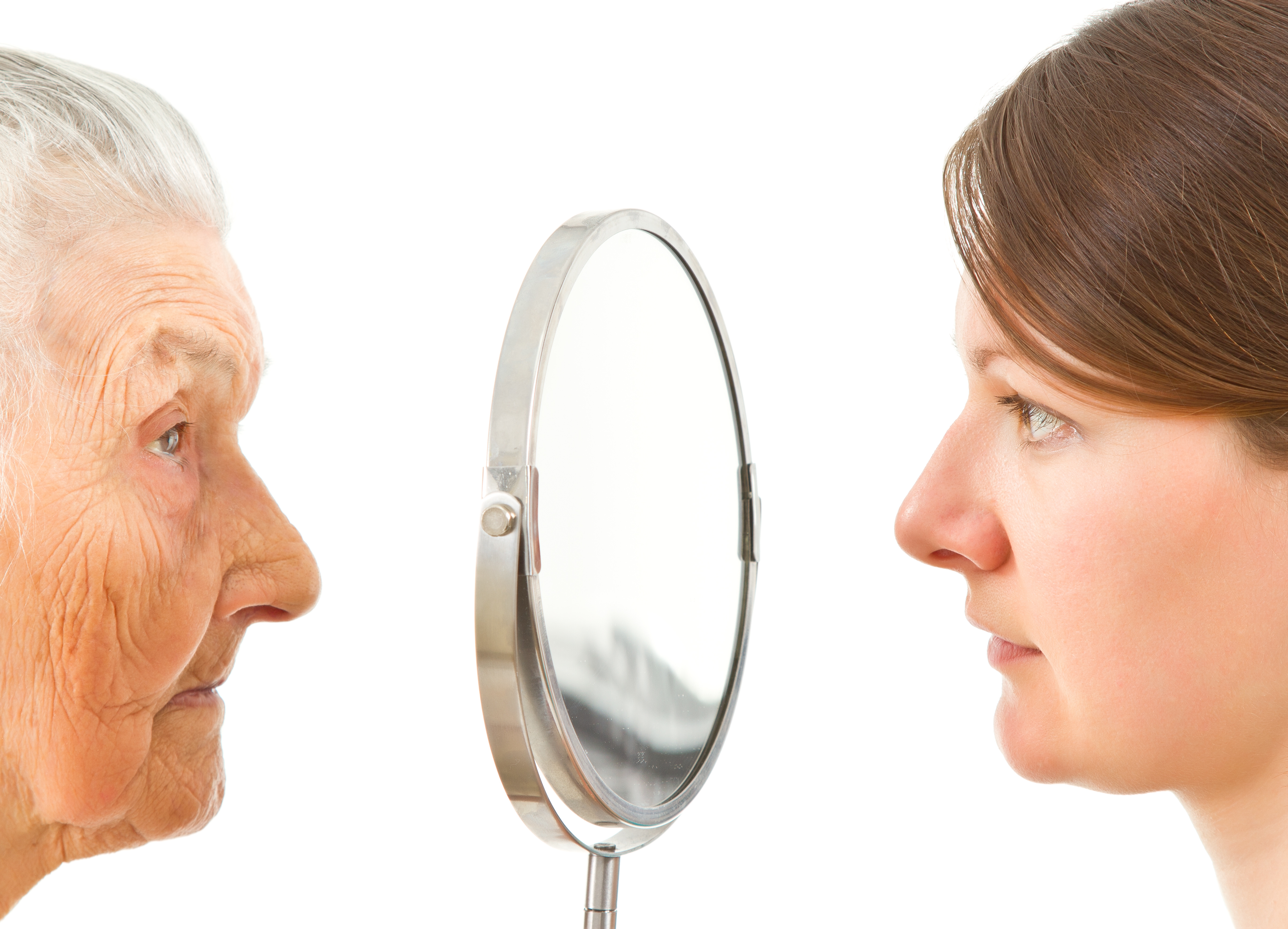 young and old  isolated faces standing on the two sides of the  mirror